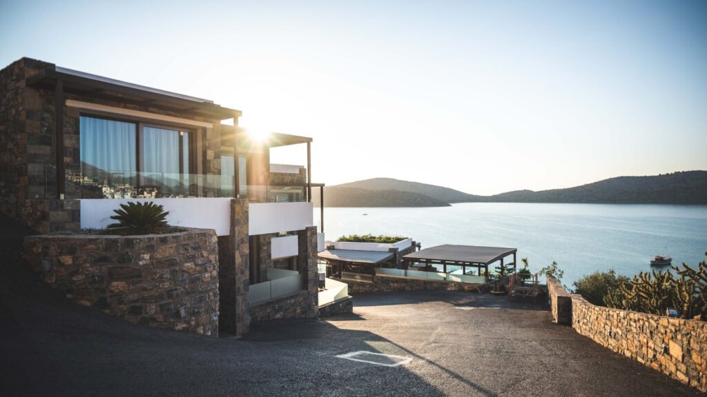 Sun Piercing of Brown Concrete House Near Sea : Property Advertising Tactics in Real Estate Marketing
